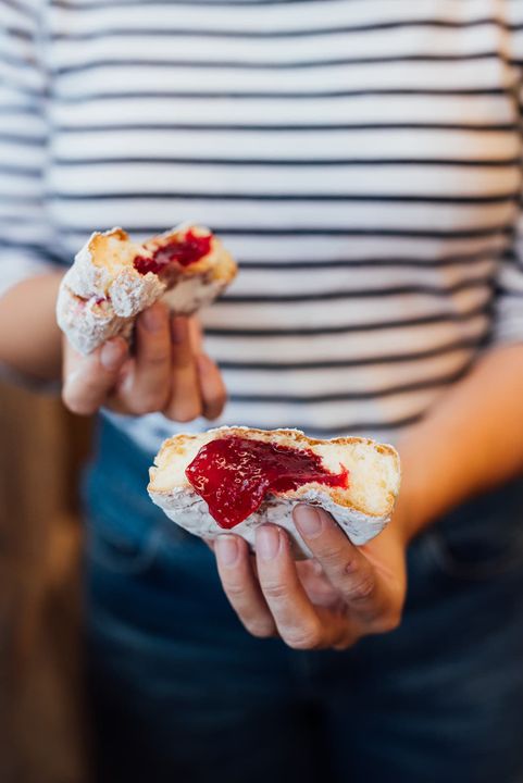 Person holding a donut from Bernie Beigne